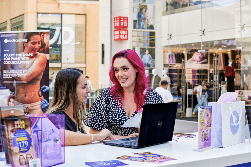 Thérapie Clinic aesthetics promotion at Braehead Shopping Centre engaging shoppers with cosmetic treatment sign-ups.